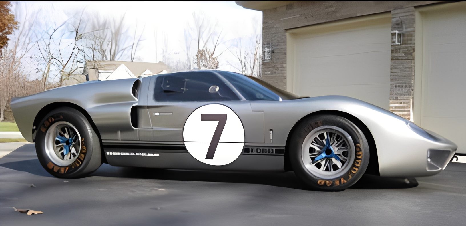 Silver race car with number seven displayed.