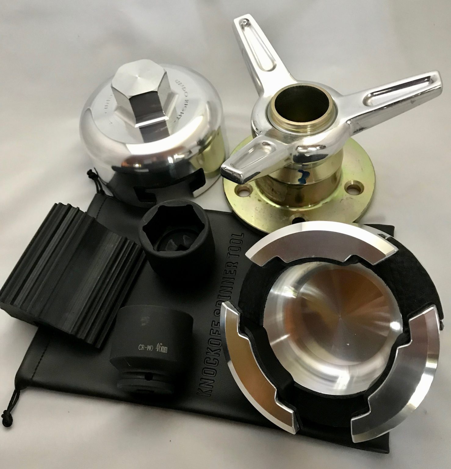 Car wheel hub tools and accessories displayed.