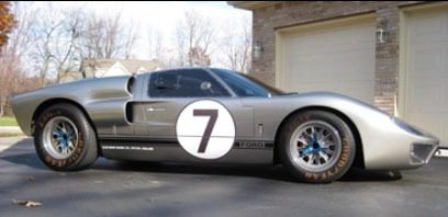 Silver race car with number seven decal.