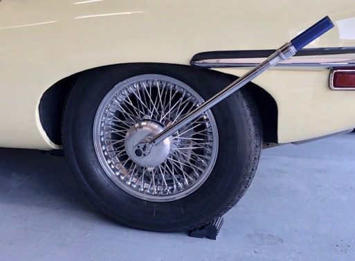 Car wheel with a wrench attached.