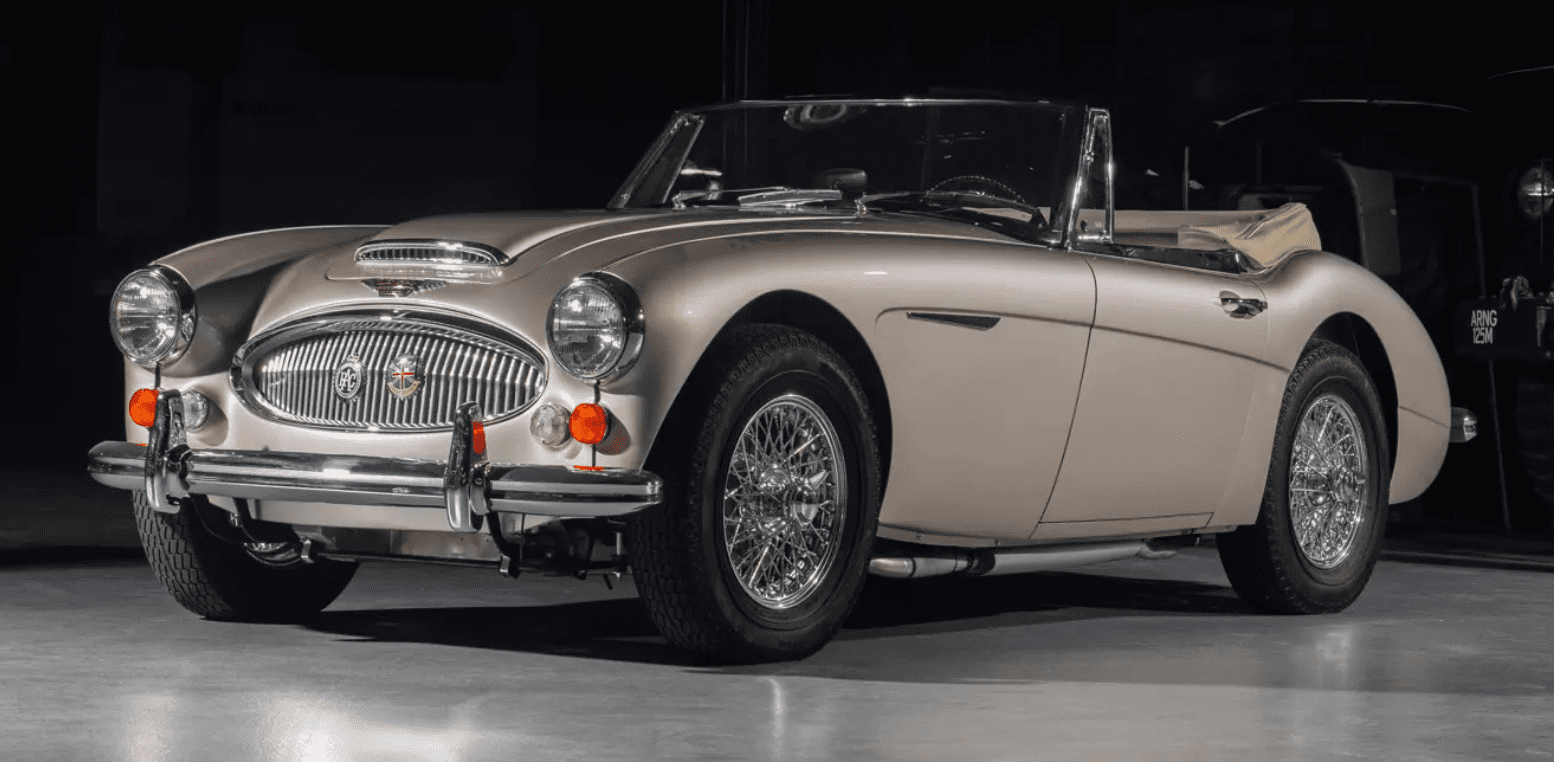 Classic vintage convertible car on display.
