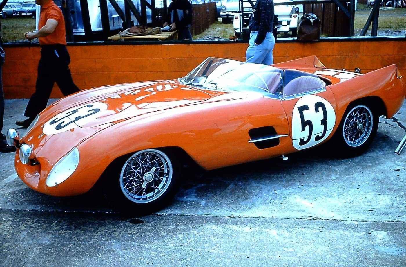 Vintage orange race car with number 53.