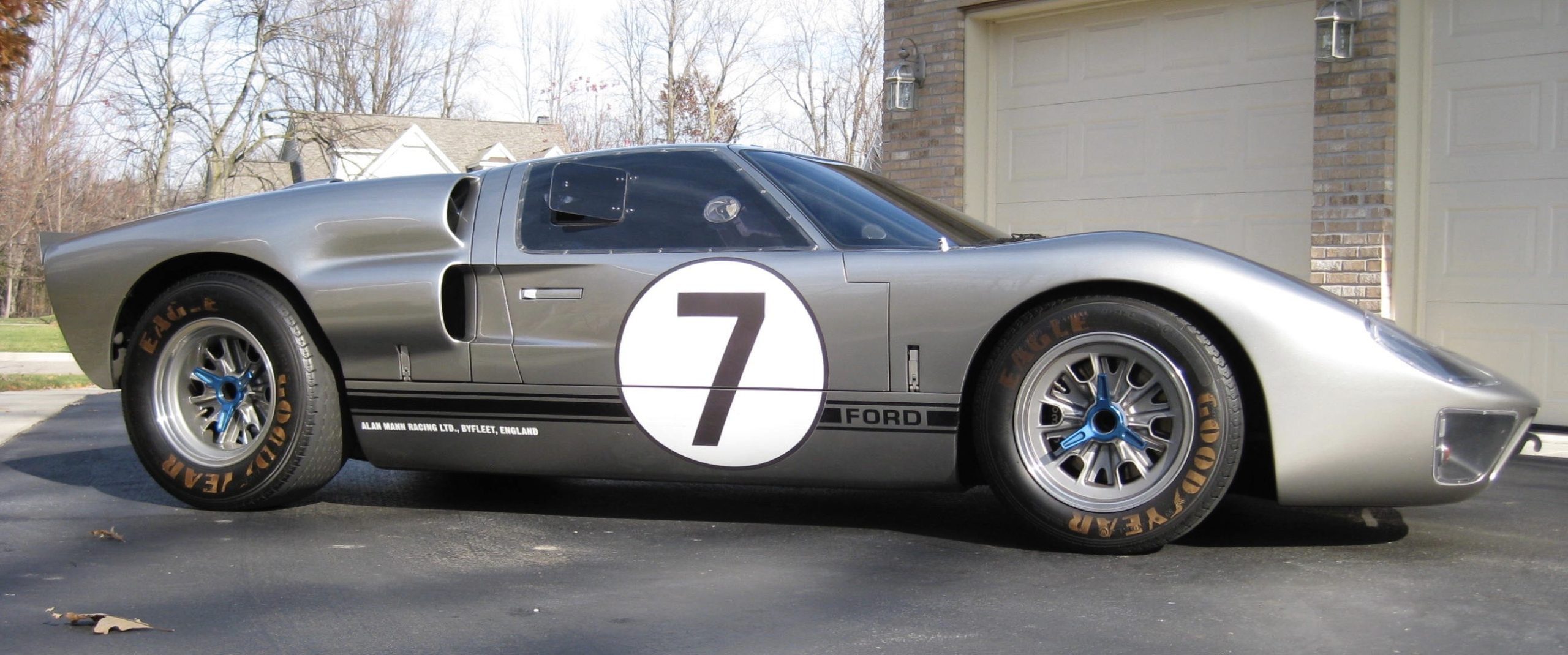Silver race car with number seven decal.